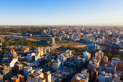 High angle view of buildings in city against clear sky