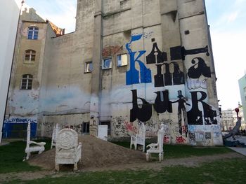 Graffiti on built structure against sky