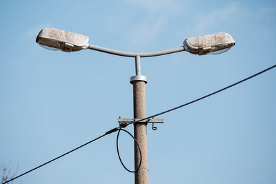 Low angle view of street light against clear sky