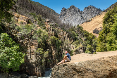 Full length of person on rocks against mountains