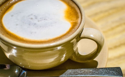 Close-up of cappuccino on table