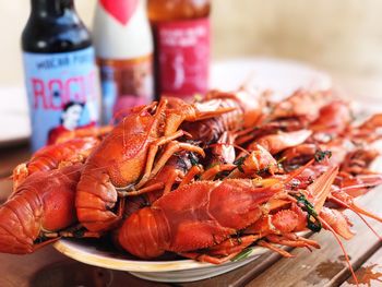 Close-up of cooked lobsters in plate on table