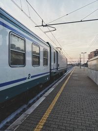 Train at railroad station against sky