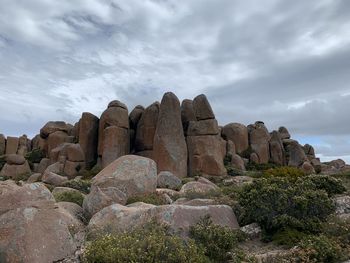 Rock formations on landscape against sky - the pinnacles on mount wellington