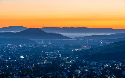 High angle view of city at sunset