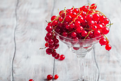 Close-up of red berries on glass