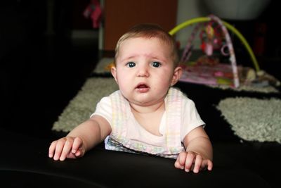 Portrait of cute baby girl at home