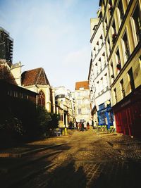 Street in city against sky