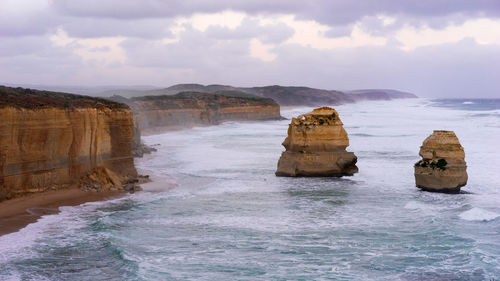 Scenic view of sea against cloudy sky