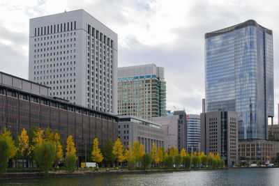 Low angle view of modern buildings against sky in city