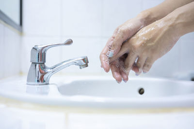 Wash your hands, soap your hands. women's hands are washed with soap. hand hygiene, skin 