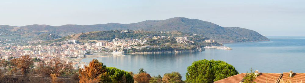 Panoramic view of bay against clear sky