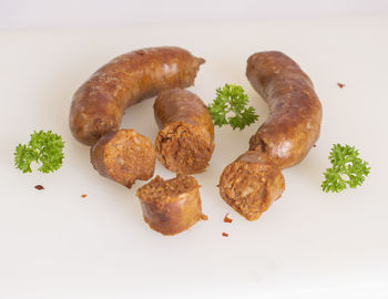 High angle view of food in plate against white background