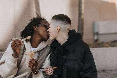 Young women kissing each other