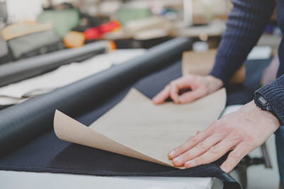 Midsection of person working on table