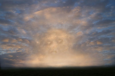 Scenic view of sea against dramatic sky