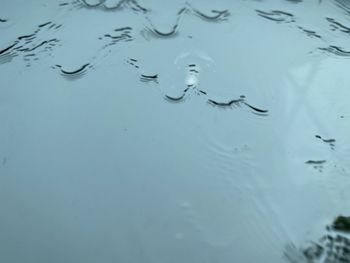 Full frame shot of raindrops on sea