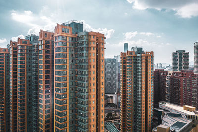 Modern buildings in city against sky