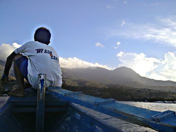 Scenic view of mountains against cloudy sky