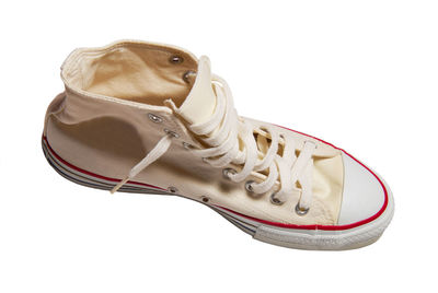 Close-up of shoes against white background