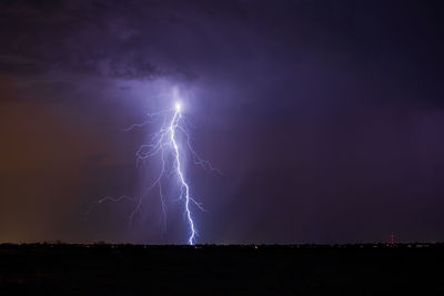 Low angle view of lightning against sky at night