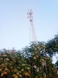 Low angle view of communications tower against sky