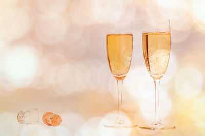 Close-up of wine glasses on table