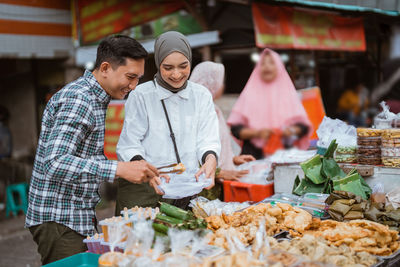 Portrait of smiling man preparing food