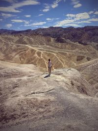 Man standing on arid landscape