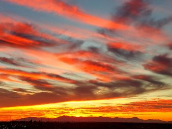 Low angle view of dramatic sky during sunset
