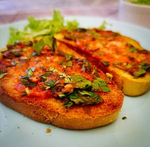 High angle view of pizza in plate on table