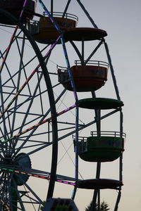 Low angle view of ferris wheel against sky