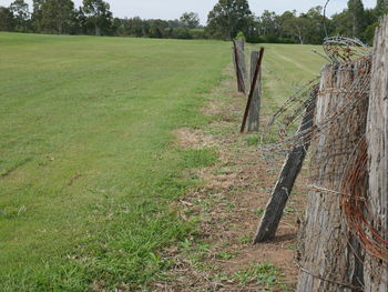 Wooden fence on field