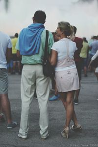 Full length of young woman standing on ground