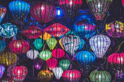 Full frame shot of illuminated colorful lanterns hanging at night