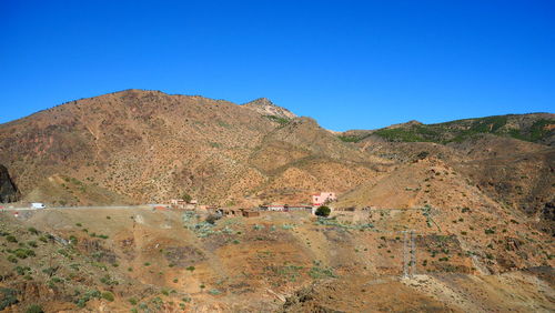 Scenic view of mountain against clear blue sky