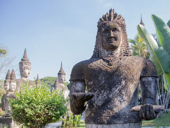 Statue of historic building against sky