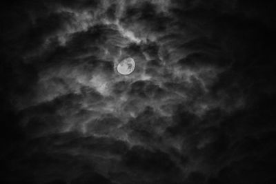 Low angle view of moon against sky at night