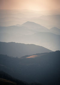 Scenic view of mountains against sky during sunset