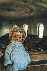 Close-up of old doll in abandoned building