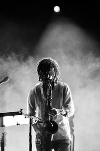 Low angle view of man playing guitar