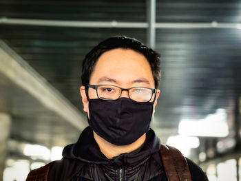 Portrait of young man wearing eyeglasses