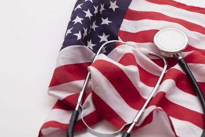 Close-up of american flag against white background