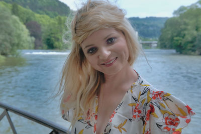 Portrait of smiling young woman in water