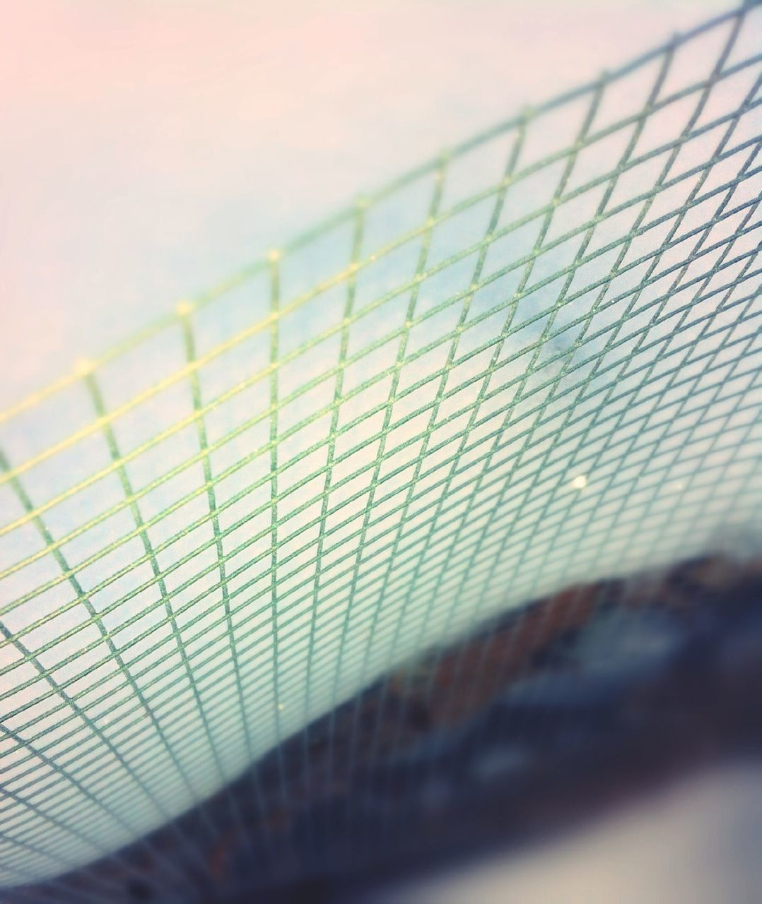 indoors, pattern, selective focus, metal, close-up, built structure, architecture, low angle view, focus on foreground, metallic, no people, design, shadow, geometric shape, sunlight, wall - building feature, day, railing, focus on background, surface level