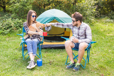 Couple sitting in tent