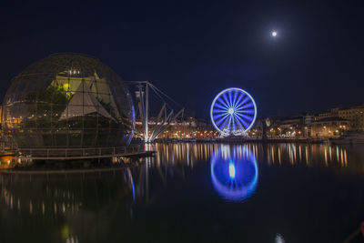 Reflection of illuminated buildings in water