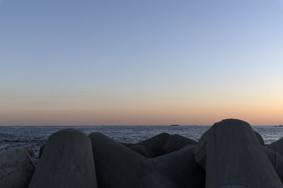 Scenic view of sea against clear sky during sunset