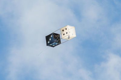 Low angle view of kite flying in sky