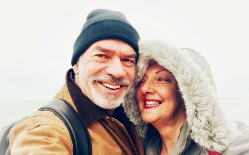 Portrait of smiling man and woman in winter